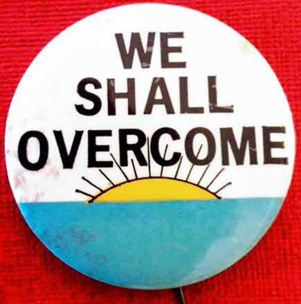 [We Shall Overcome pin with sun motif]